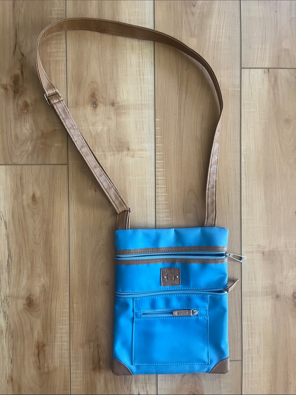 Stone Mountain Accessories Blue Crossbody Bag with Tan Trim